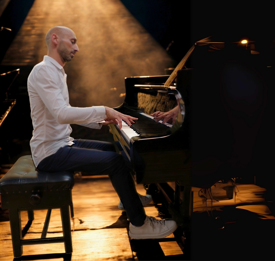 Tim Dimov playing piano on stage